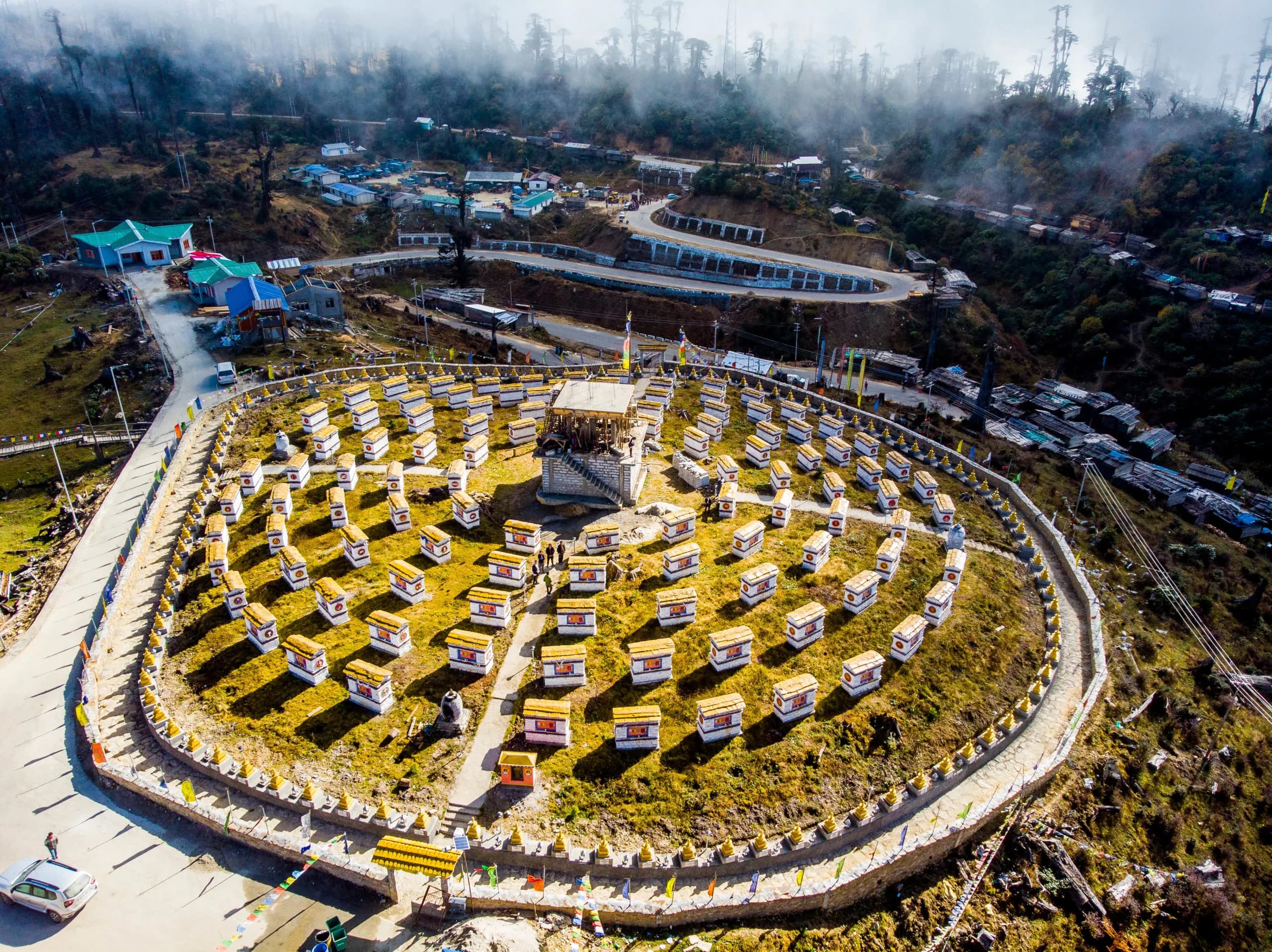 Cross the technical hairpins of Mandala Top (10,000 ft).